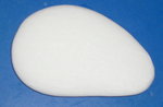 Soap most commonly appears in bar form. This particular bar of soap has seen some use and thus has lost its "bar" shape.