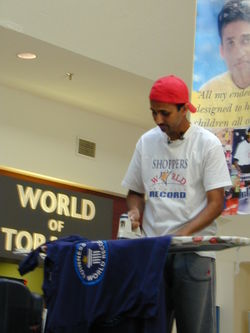 Suresh Joachim, minutes away from breaking the ironing world record at 55 hours and 5 minutes, at Shoppers World Brampton.