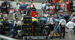 Formula One tires being pushed on to the grid in carts at the 2005 United States Grand Prix