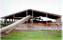 Image of a biomass fuel, probably wood chips, being stored and dried for later use in a boiler.