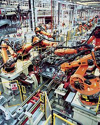 Robots doing vehicle underbody assembly (KUKA).