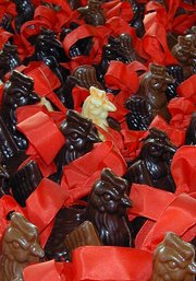 Chocolate, ranging from dark to light, can be molded and decorated like these chickens with ribbons.