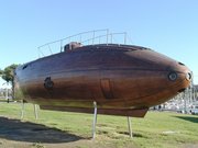 A replica of Monturiol's wooden Ictineo II stands near Barcelona harbor