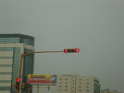 This traffic light in Khobar is video camera-synchronized (just above the vertical light) and also shows the seconds remaining to change to the next state (in the horizontal light)