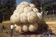 NASA engineers test the  airbag landing system on simulated martian terrain.