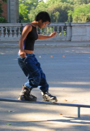 Roller skating girl in Rome, Italy (soul grind)