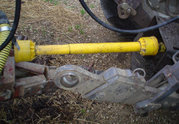 A PTO shaft plugged into a tractor.