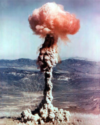A radioactive fireball tops the smoke column from a nuclear weapon test.