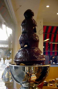 Chocolate, with enough cocoa butter, flows over a to serve .