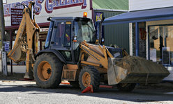 A common backhoe-loader. The backhoe is on the left, the bucket/blade on the right.