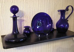 Metallic additives in the glass mix can produce a variety of colors. Here  has been added to produce a bluish colored decorative glass