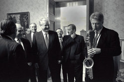 Bill Clinton plays the tenor saxophone given to him by Boris Yeltsin, fourth from right.