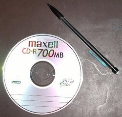 Size of CD compared to pencil.