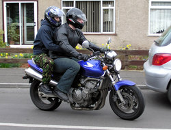 Motorcyclists on a Honda CB600F Hornet.