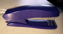 Manually operated stapler