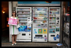Cigarette vending machines in Tokyo, with promotion girl