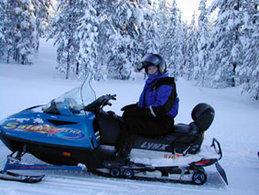 Picture of a snowmobile with a single rider