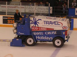 An ice resurfacer lays down a layer of clean water, which will freeze to form a smooth ice surface.