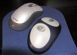 Two wireless computer mice, with scroll wheels