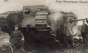 This German photograph from World War I shows a captured British tank. The foremost part of the tracks is high off the ground in order to climb obstacles. The main guns are side-mounted to keep the centre of gravity low