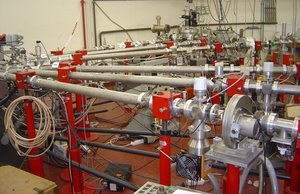 The output of a particle accelerator can generally be directed towards multiple lines of experiments, one at a given time, by means of a deviating electromagnet. This makes it possible to operate multiple experiments without needing to breach the void to move tubes around.