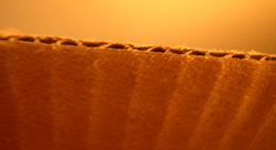 Corrugated cardboard is given its strength by a waving middle layer