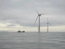 Picture of wind turbines in the ocean.