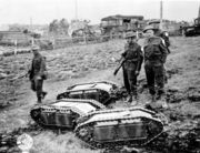 British soldiers with captured German Goliath remote-controlled demolition vehicles (Battle of Normandy, 1944).