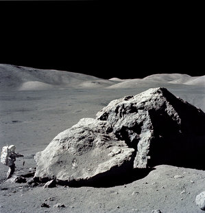 Astronaut Harrison Schmitt collecting rocks from the Moon during the Apollo XVII mission.