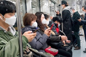 people in subway korea wearing masks